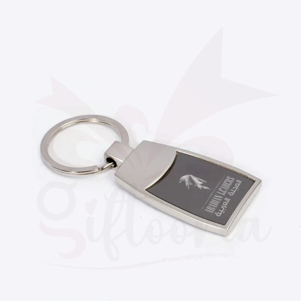 Elegant rectangular metal keychain with enamel-finished branding. Ideal for official use, promotional kits, and professional distribution.