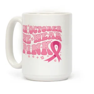 White ceramic mug with pink text “In October We Wear Pink” and breast cancer ribbon – perfect Pinktober awareness and corporate gift item